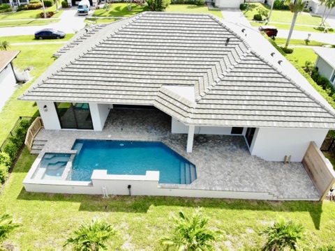 Aerial view of Delbrook Way home with pool and spa on Marco Island