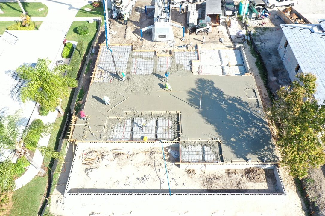 Aerial view of the crew pouring the concrete slab