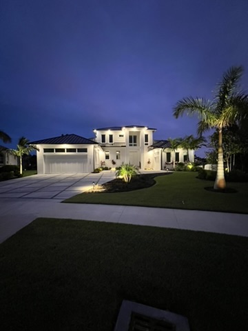 The finished home lit up at night