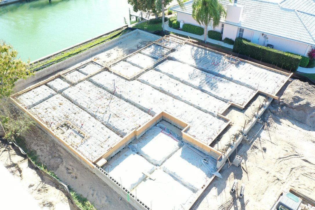 Aerial view of the formed and reinforced foundation beside the canal