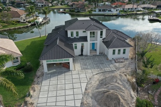 Aerial view of a waterfront home under construction