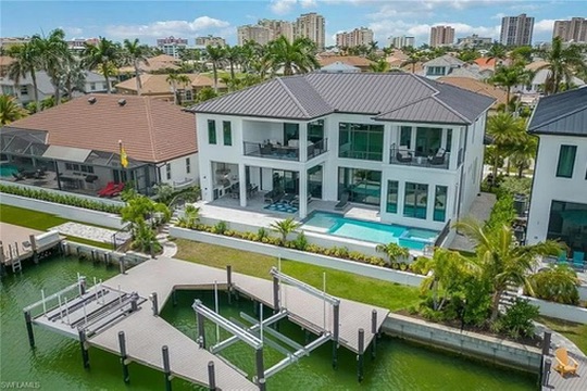 Pelican Court waterfront home with pool and boat dock on Marco Island